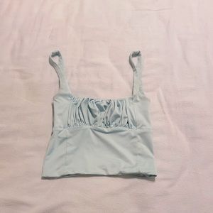 Isabelle’s Cabinet blue tank